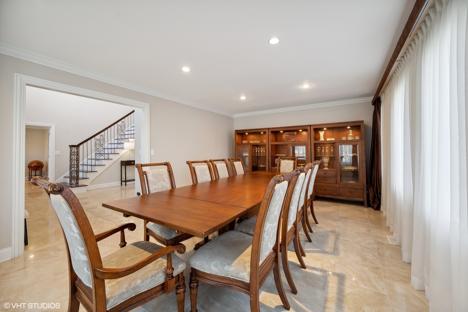 1640 Pfingsten Road Northbrook, IL 60062 - Photo 8 of 34 a view of a dining room and livingroom with furniture window and wooden floor