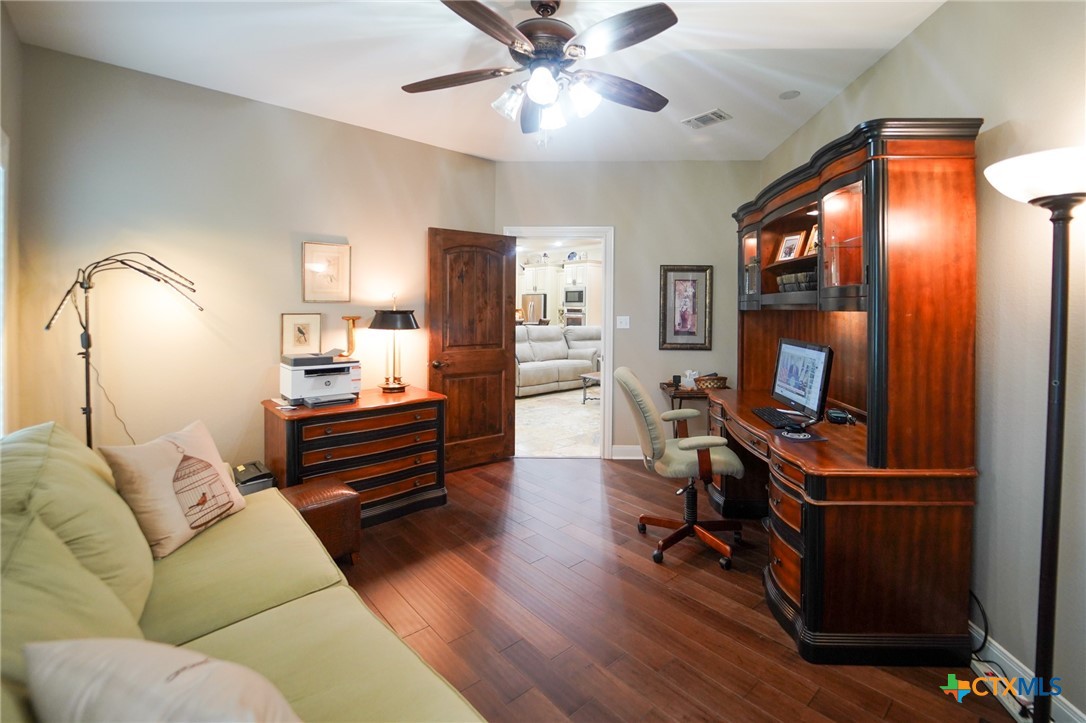 501 Barbara Street Ganado, TX 77962 - Photo 11 of 43 a living room with furniture and a flat screen tv