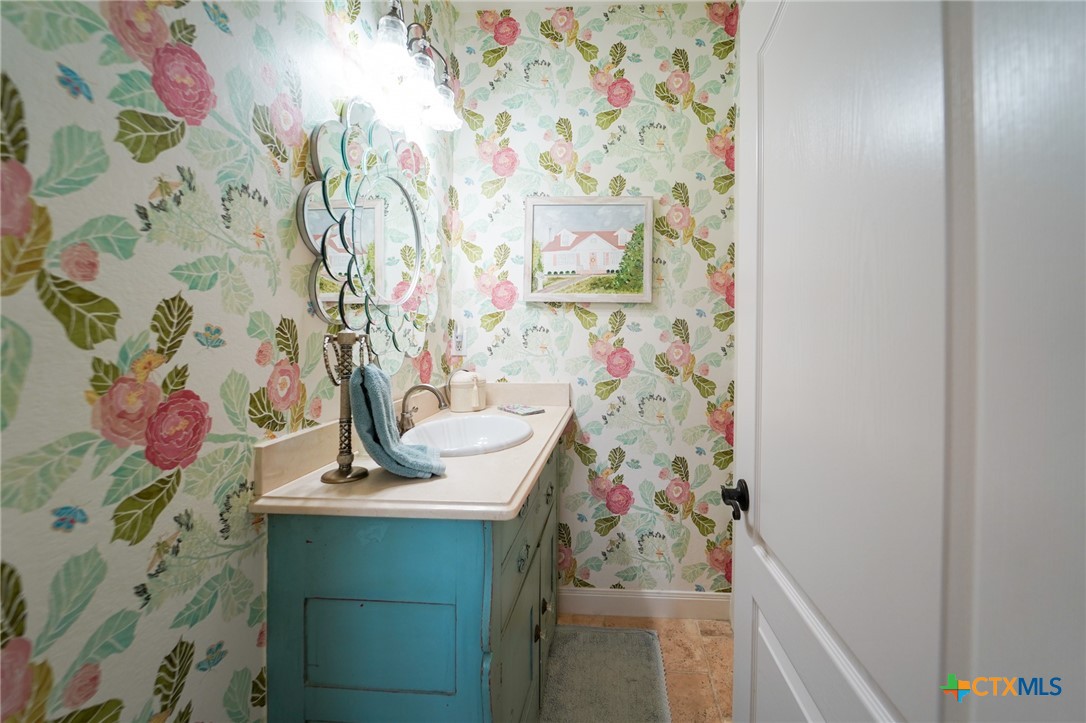 501 Barbara Street Ganado, TX 77962 - Photo 18 of 43 a bathroom with a sink and a curtain