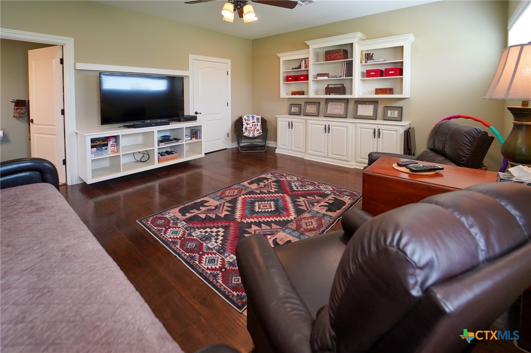 501 Barbara Street Ganado, TX 77962 - Photo 20 of 43 a living room with furniture and a flat screen tv