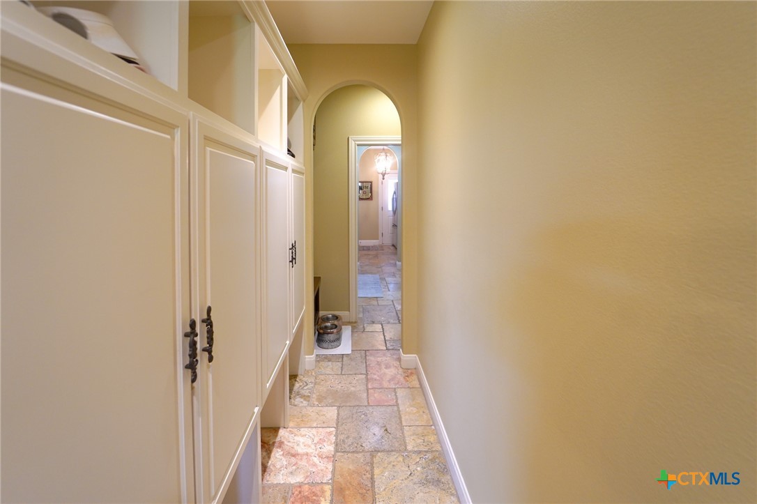 501 Barbara Street Ganado, TX 77962 - Photo 24 of 43 The back hallway that comes in from the garage features a bench for putting on your shoes and built-in cubbies where backpack, shoes, boots, hats and sporting gear are dropped and available for the grab and get to where you're going. And....the best part-- it keeps all the clutter and chaos confined and properly stored out of sight!