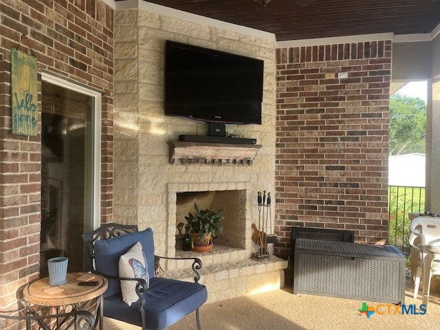 501 Barbara Street Ganado, TX 77962 - Photo 26 of 43 a living room with furniture a flat screen tv and a fireplace
