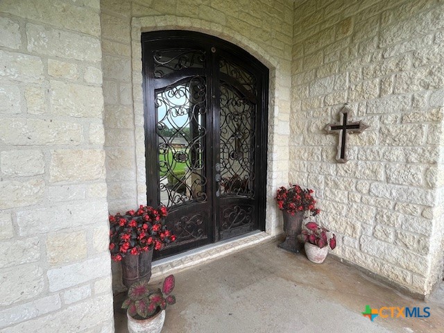501 Barbara Street Ganado, TX 77962 - Photo 33 of 43 The welcoming front porch with massive, ornate double doors is the segue to what lies beyond.