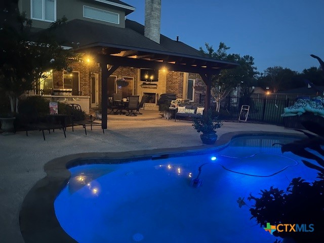 501 Barbara Street Ganado, TX 77962 - Photo 36 of 43 Who could resist an evening here? What a dream the ambient pool and pergola lighting provides anytime of year and what fun it is to share that with friends and family!