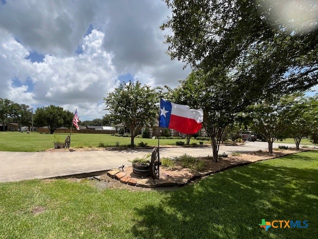 501 Barbara Street Ganado, TX 77962 - Photo 41 of 43 Here's your drive up. Beautiful, tree-lined driveway with mature crepe myrtles, knock out roses, and flagstone-rocked border welcome you home and your guests for memory-making gatherings.