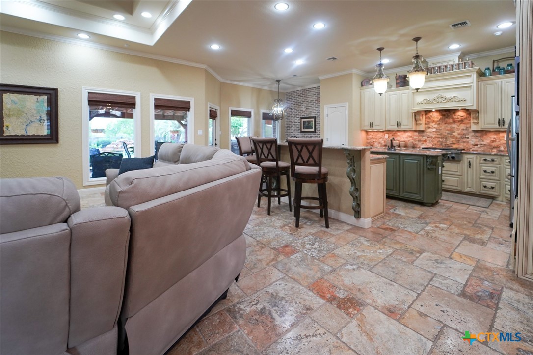 501 Barbara Street Ganado, TX 77962 - Photo 7 of 43 a living room with furniture a large window and kitchen view