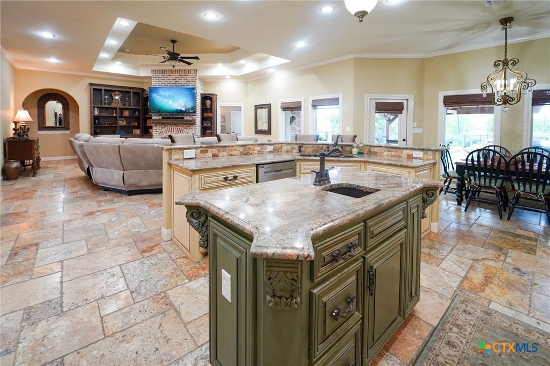 501 Barbara Street Ganado, TX 77962 - Photo 8 of 43 From this view, the spaciousness of this popular area of the home is on display. The openess of this functional kitchen just invites help at meal time and a large breakfast bar is the perfect place for the on-lookers to keep the resident cook company.