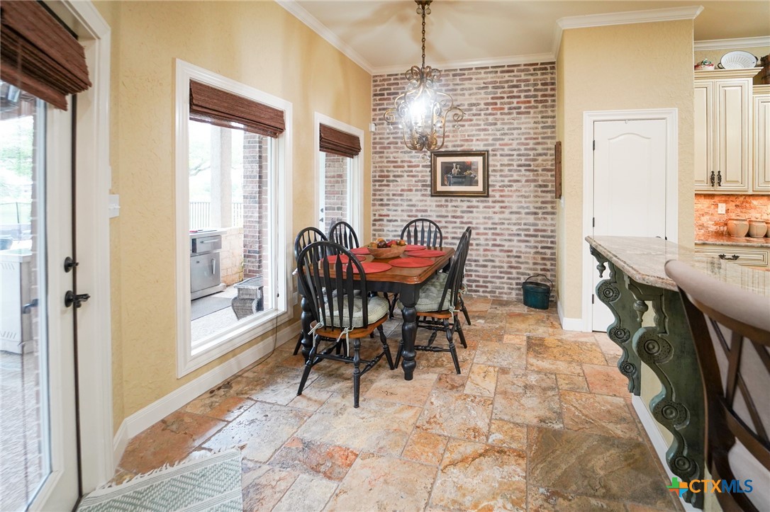 501 Barbara Street Ganado, TX 77962 - Photo 10 of 43 a dining room with furniture and wooden floor