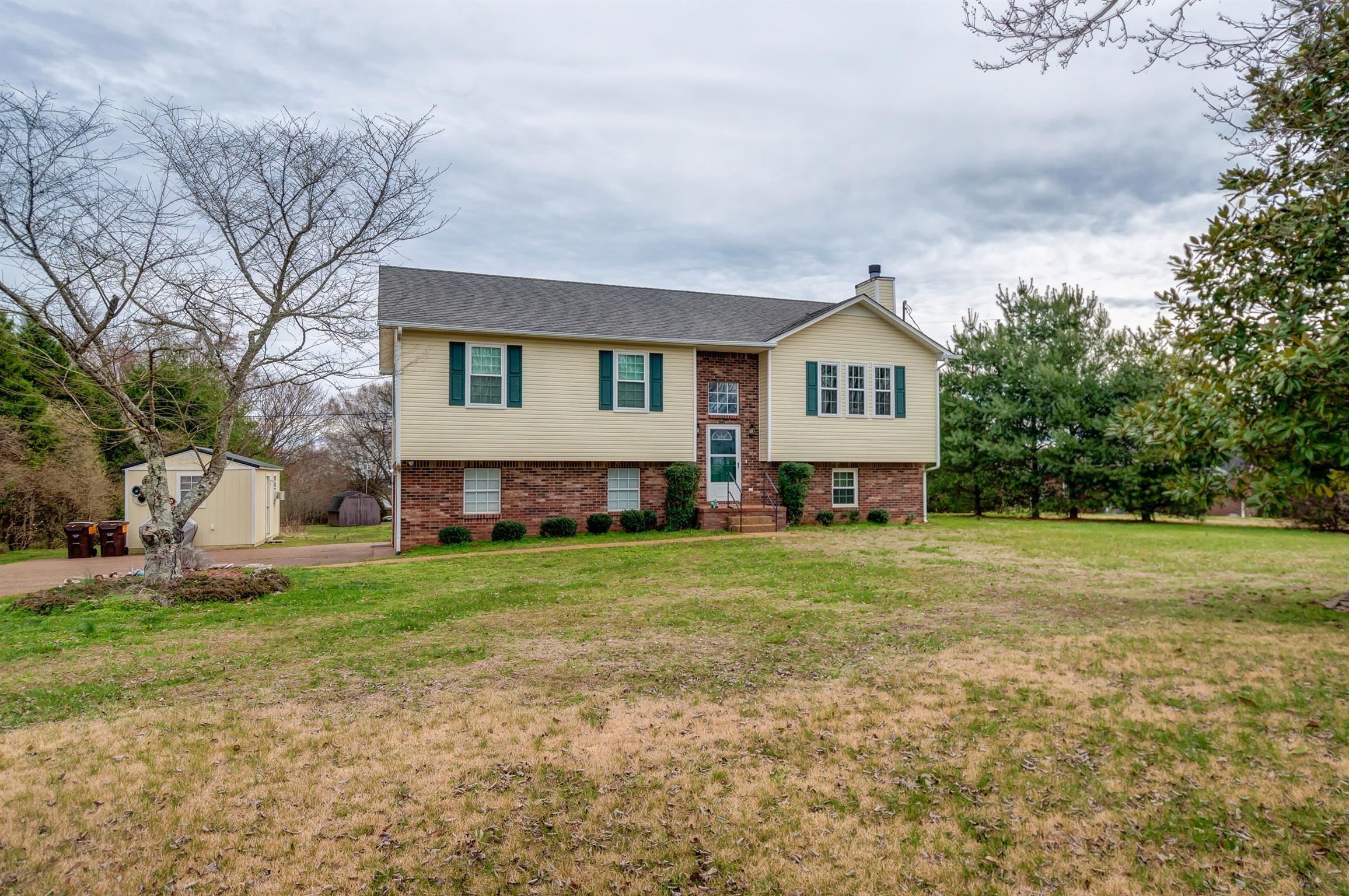 2142 Clara Mathis Road Spring Hill, TN 37174 - Photo 1 of 20 a front view of house with yard and green space