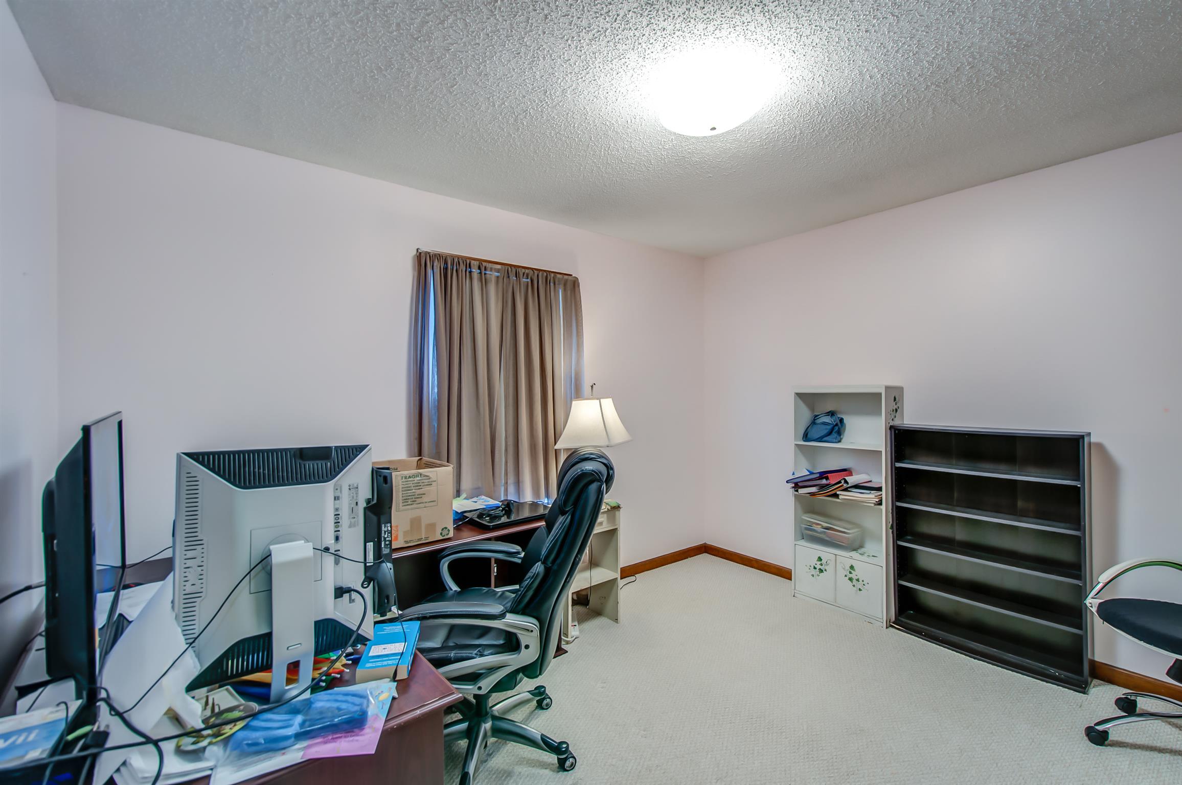 2142 Clara Mathis Road Spring Hill, TN 37174 - Photo 13 of 20 a view of a workspace with furniture and a window