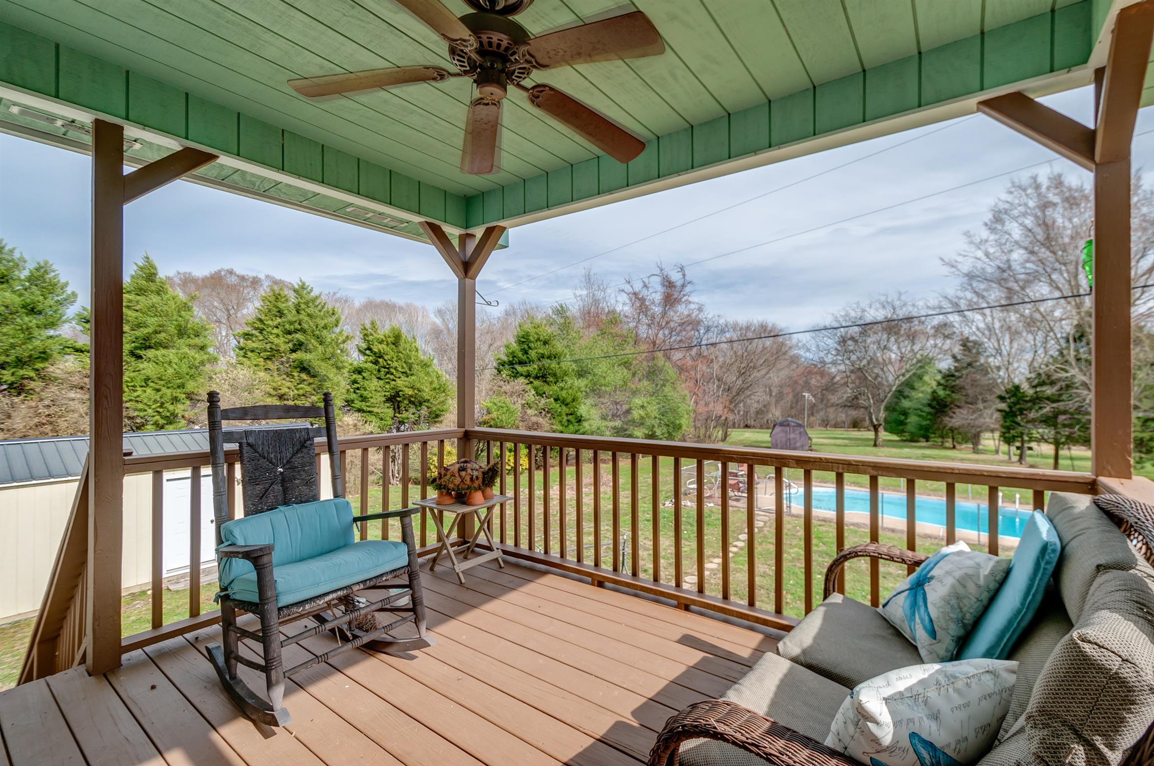 2142 Clara Mathis Road Spring Hill, TN 37174 - Photo 17 of 20 a view of a balcony with chairs and wooden floor
