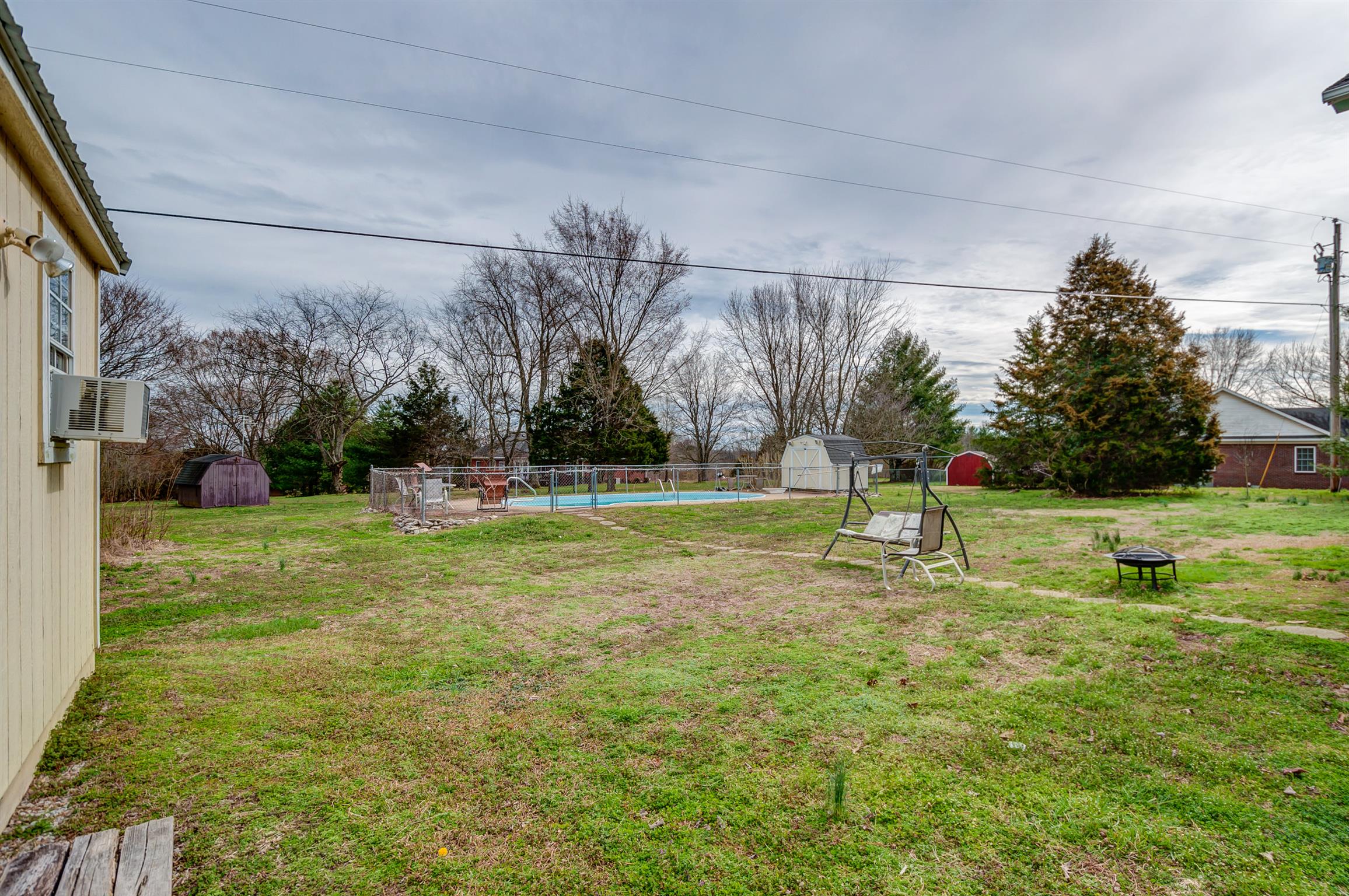 2142 Clara Mathis Road Spring Hill, TN 37174 - Photo 20 of 20 a swimming pool with lots of tress in front of it