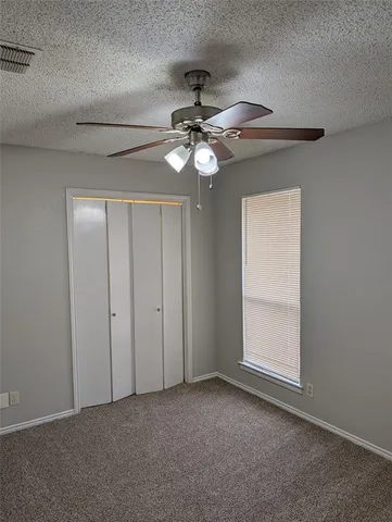 a view of a chandelier fan in a room