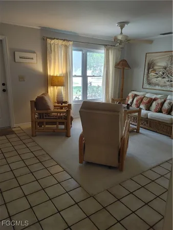 a bedroom with a bed and lamp