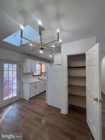a view of a kitchen with a sink and a window