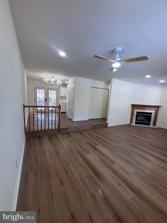 a view of livingroom with hardwood floor and ceiling fan