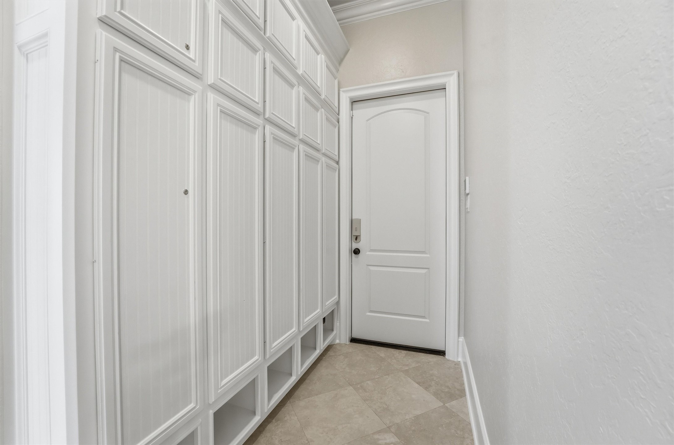 70 Quail Rock Place The Woodlands, TX 77381 - Photo 26 of 46 a view of a hallway with white doors