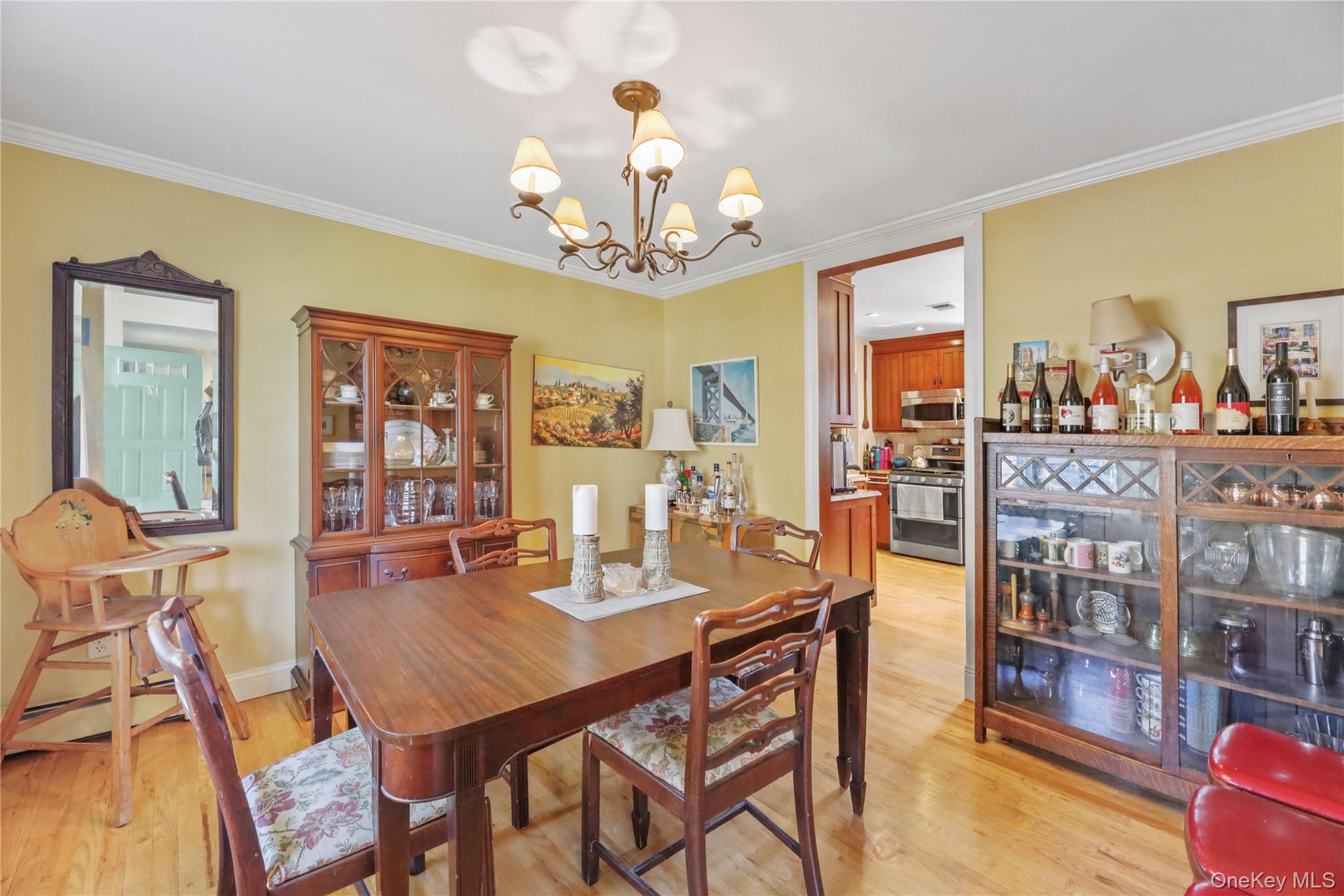 17 Jennifers Path Westhampton Beach, NY 11978 - Photo 11 of 41 a view of a dining room with furniture and a chandelier