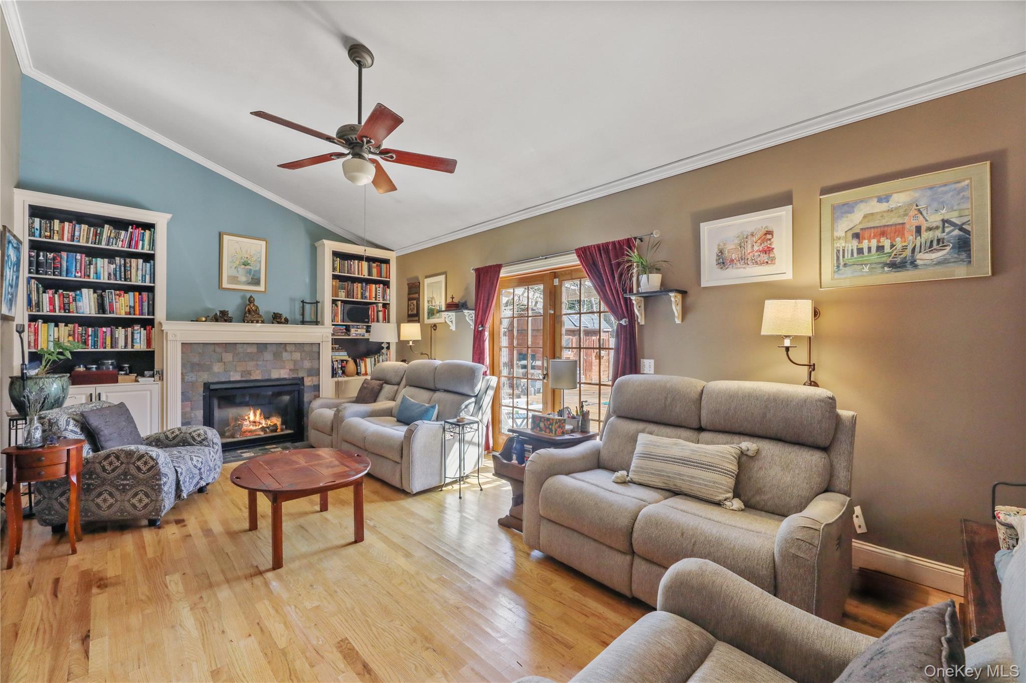 17 Jennifers Path Westhampton Beach, NY 11978 - Photo 14 of 41 a living room with furniture a fireplace and a window