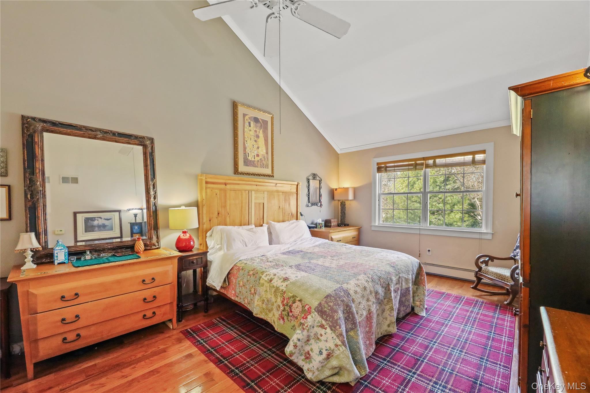 17 Jennifers Path Westhampton Beach, NY 11978 - Photo 20 of 41 a bedroom with a bed and wooden floor