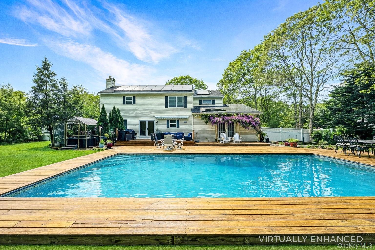 17 Jennifers Path Westhampton Beach, NY 11978 - Photo 2 of 41 a view of a swimming pool with a lounge chairs