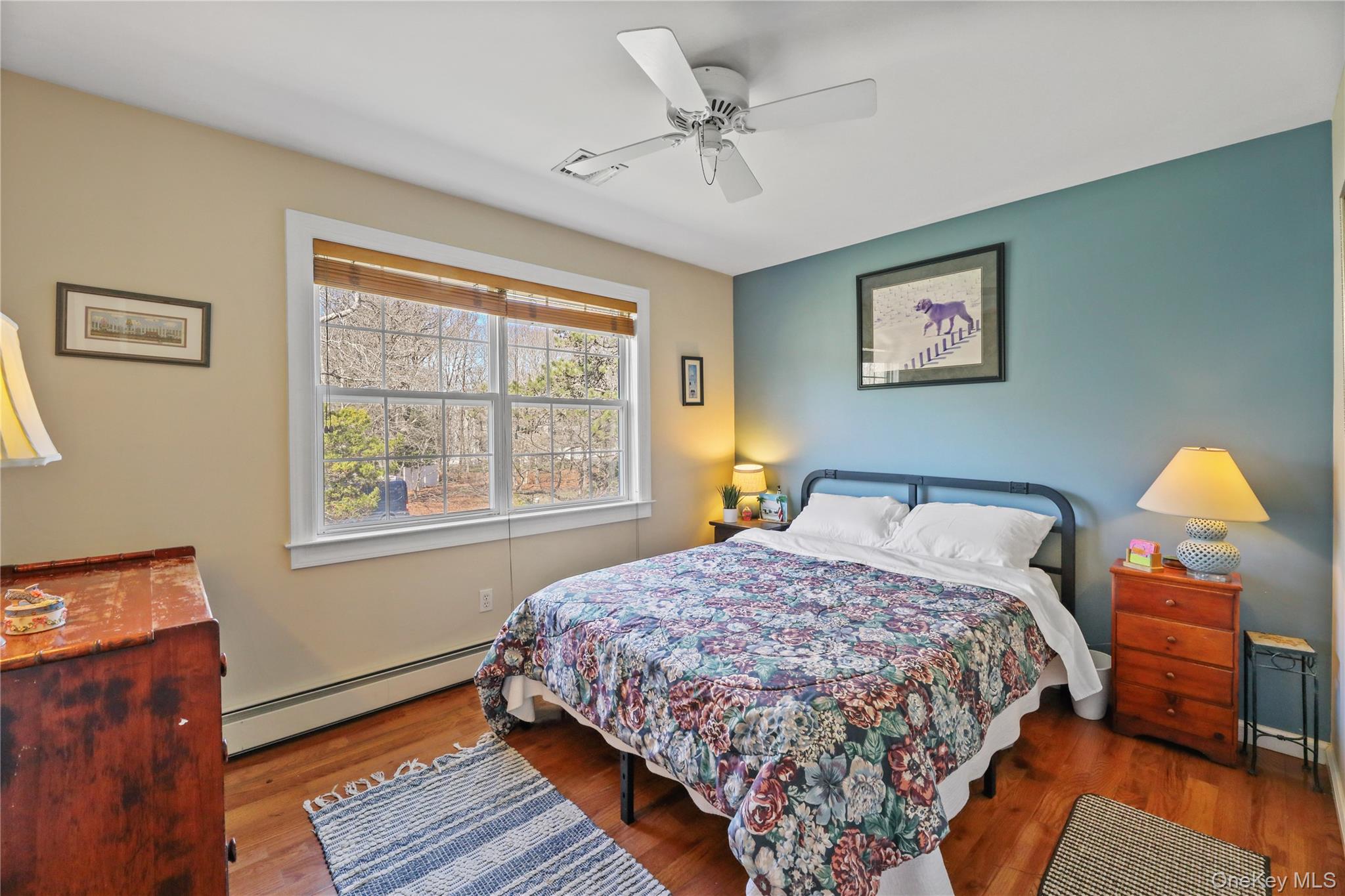 17 Jennifers Path Westhampton Beach, NY 11978 - Photo 27 of 41 a bedroom with a bed and wooden floor
