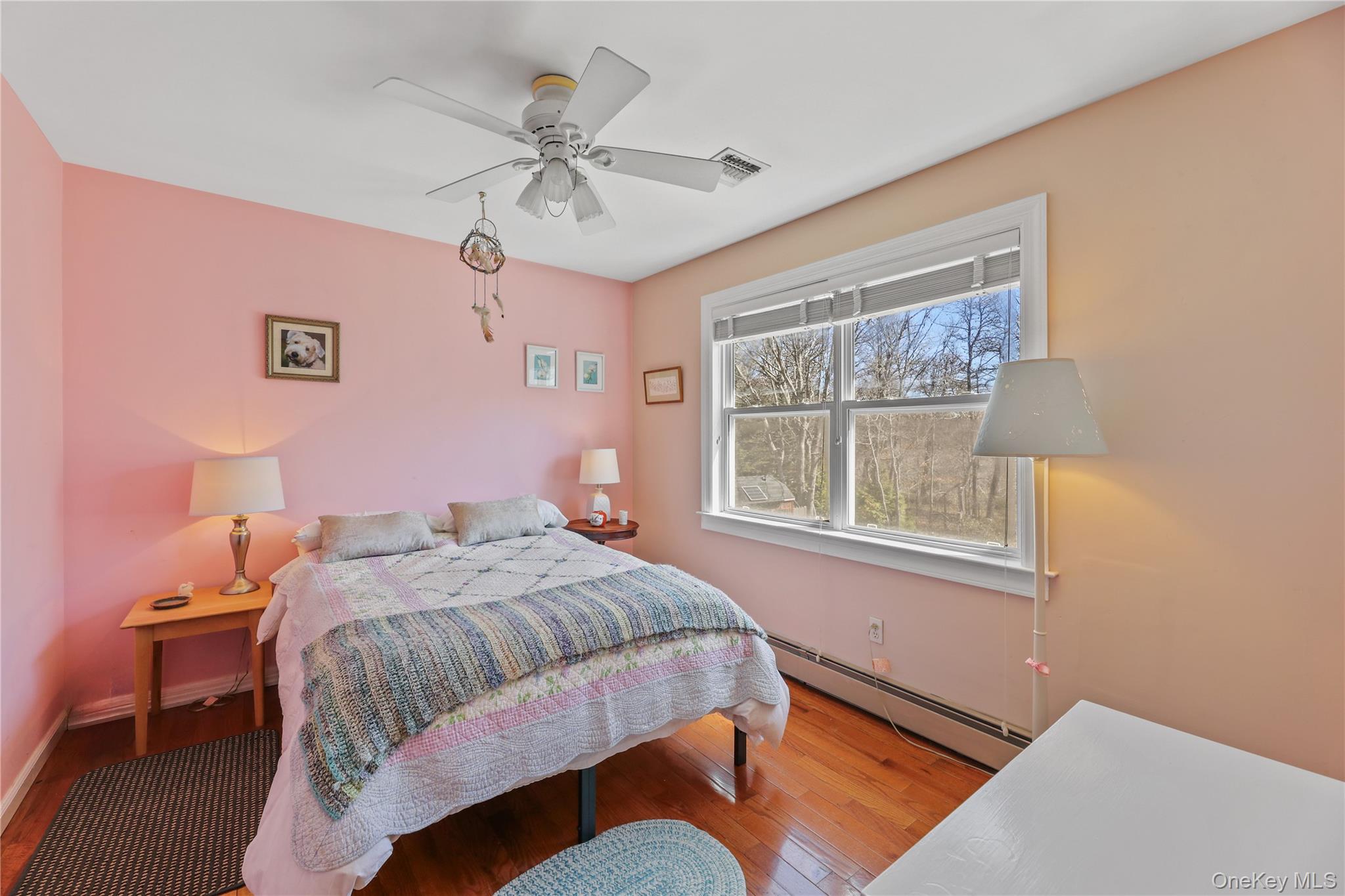 17 Jennifers Path Westhampton Beach, NY 11978 - Photo 31 of 41 a bedroom with a bed and a window
