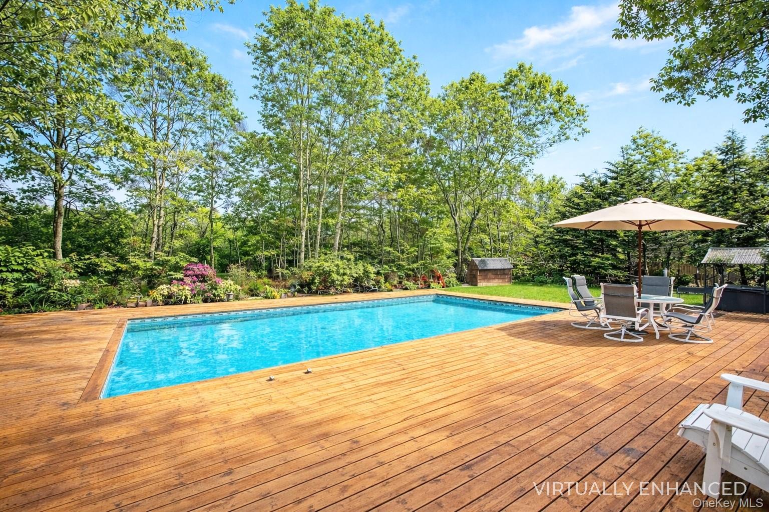 17 Jennifers Path Westhampton Beach, NY 11978 - Photo 35 of 41 a view of a swimming pool with chairs