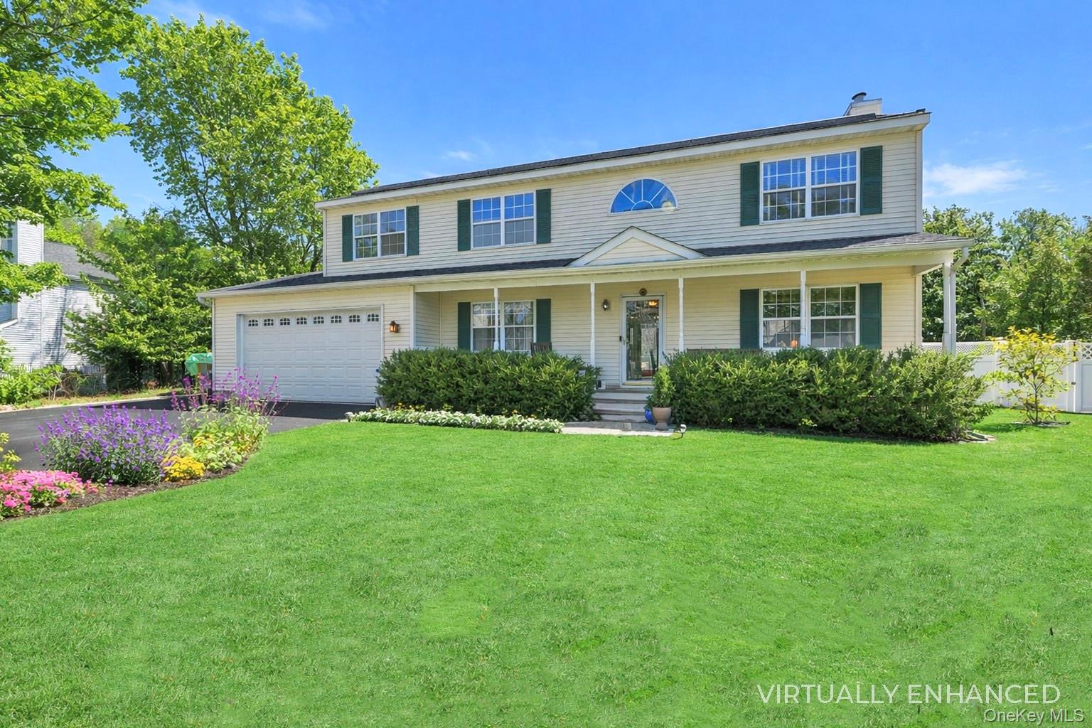 17 Jennifers Path Westhampton Beach, NY 11978 - Photo 4 of 41 a front view of house with yard and green space