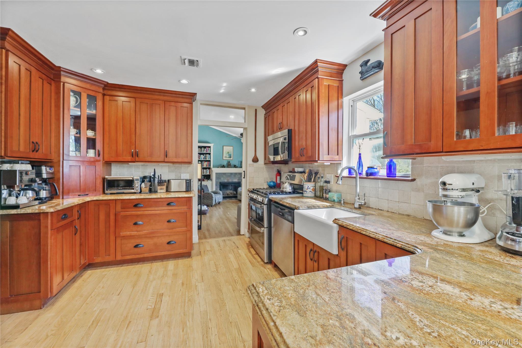 17 Jennifers Path Westhampton Beach, NY 11978 - Photo 10 of 41 a kitchen with stainless steel appliances a sink window and cabinets