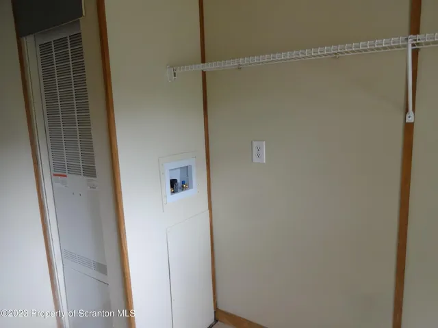 a bathroom with a glass door shower