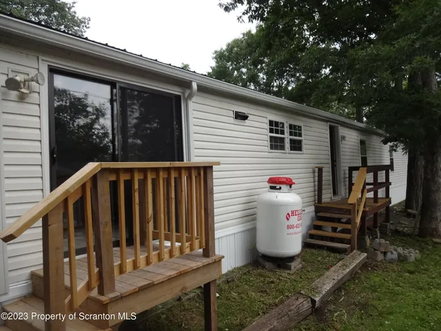 a view of a back yard of the house