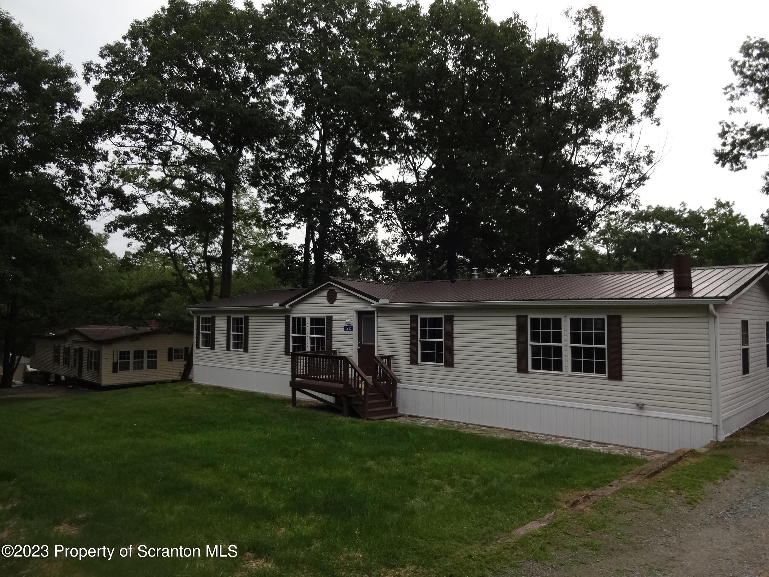 22 Hi View Terrace. Lake Ariel, PA 18436 - Photo 25 of 28 a front view of house with yard and green space