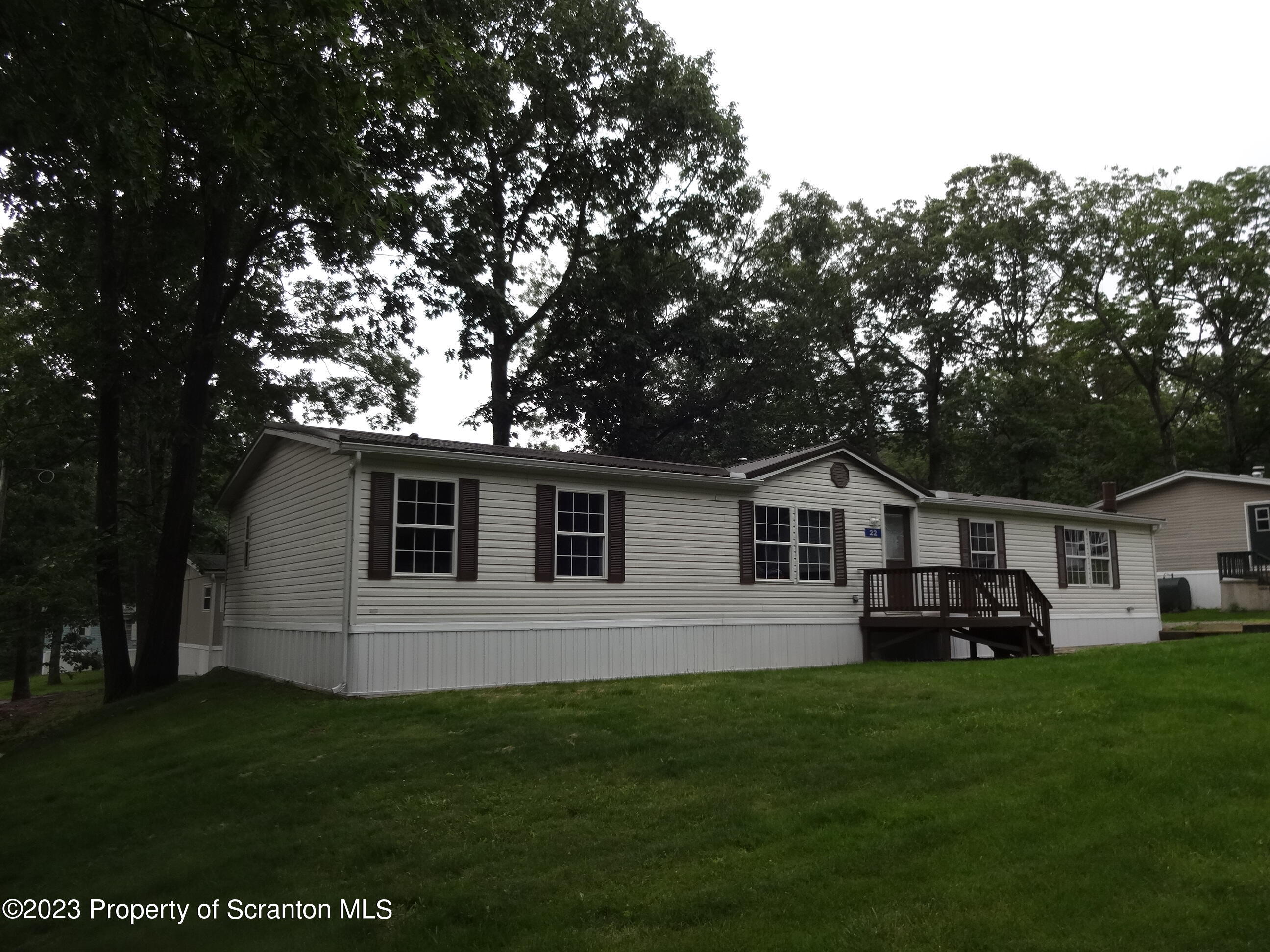22 Hi View Terrace. Lake Ariel, PA 18436 - Photo 28 of 28 a front view of a house with a garden