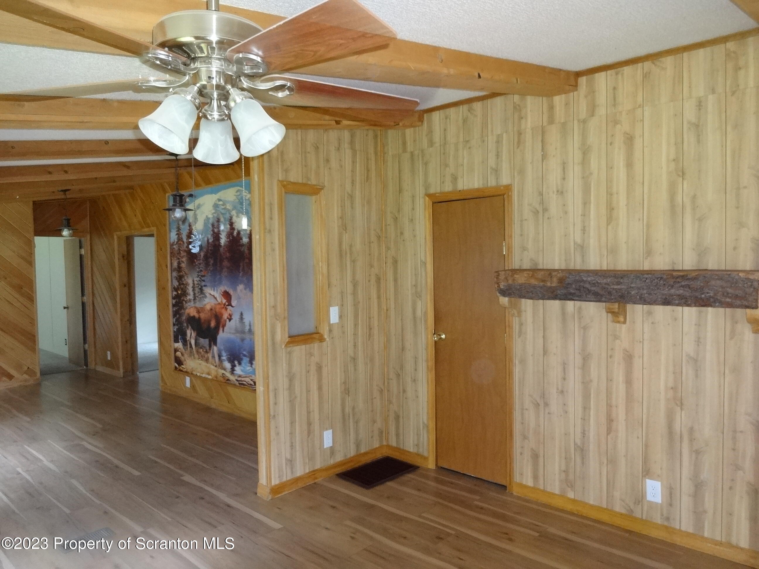 22 Hi View Terrace. Lake Ariel, PA 18436 - Photo 5 of 28 a view of a hallway with wooden floor and chandelier