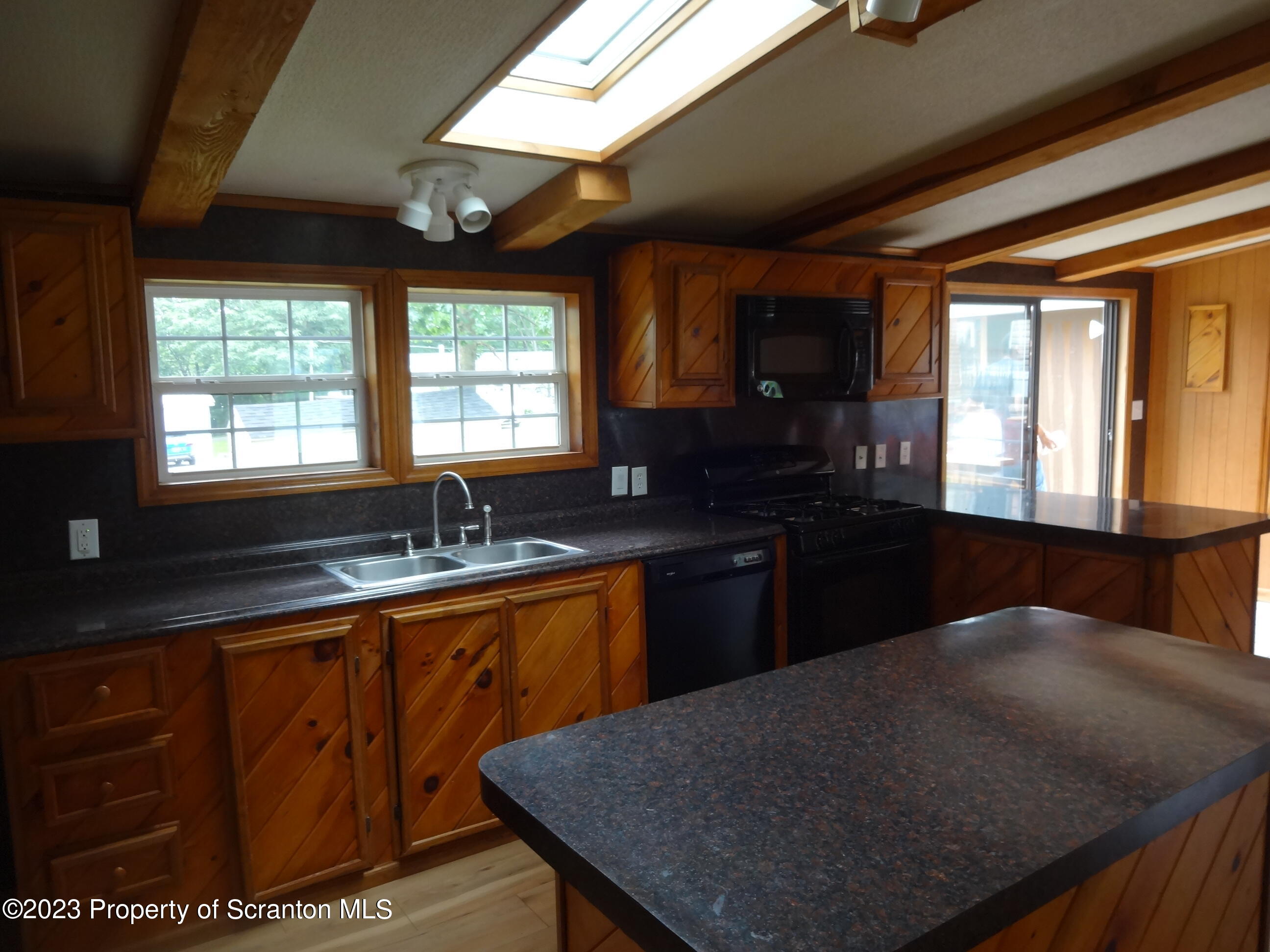 22 Hi View Terrace. Lake Ariel, PA 18436 - Photo 10 of 28 a kitchen with granite countertop sink stove and cabinets