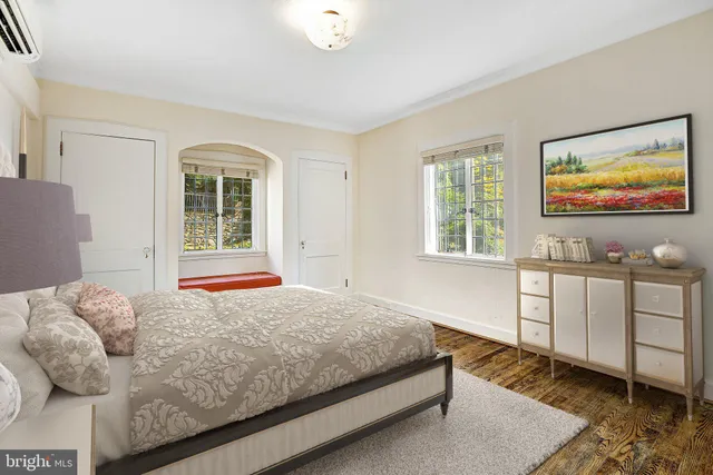 a bedroom with a bed and window