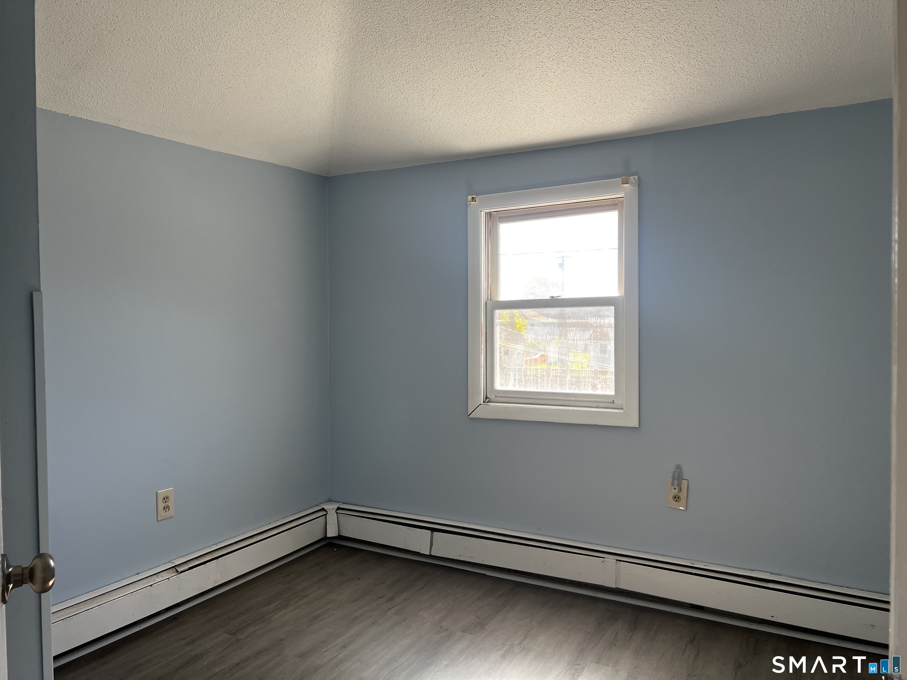 40 Portland Avenue, Unit 1 Old Lyme, CT 06371 - Photo 23 of 39 an empty room with a window
