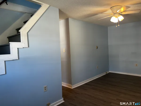 a view of an entryway with wooden floor