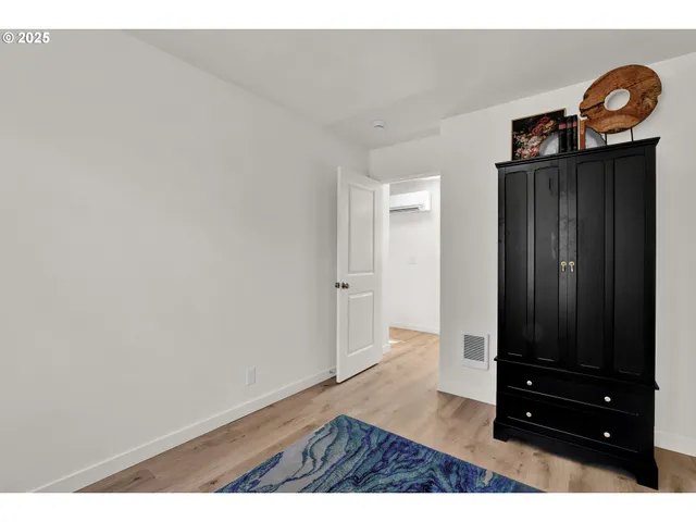a view of entryway with wooden floor