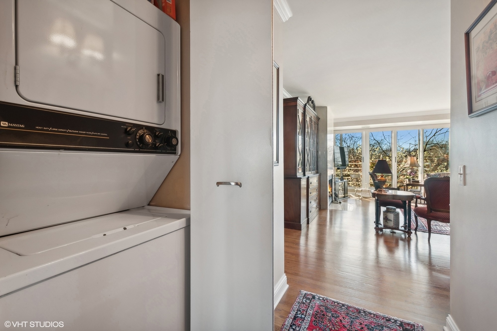 2555 Gross Point Road, Unit 412 Evanston, IL 60201 - Photo 19 of 26 a view of dining room with floor to ceiling window and kitchen view
