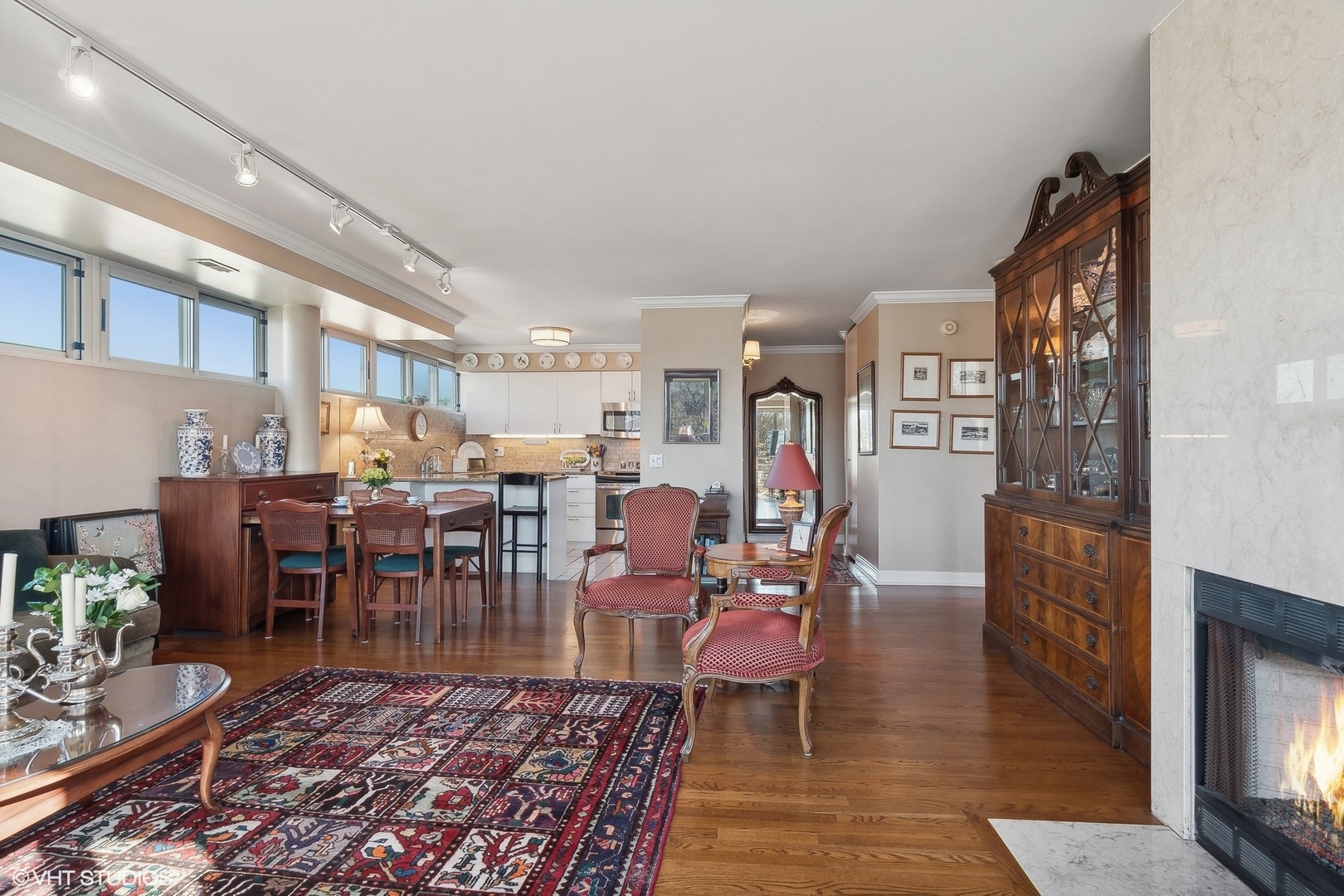 2555 Gross Point Road, Unit 412 Evanston, IL 60201 - Photo 8 of 26 a living room with lots of furniture and wooden floor