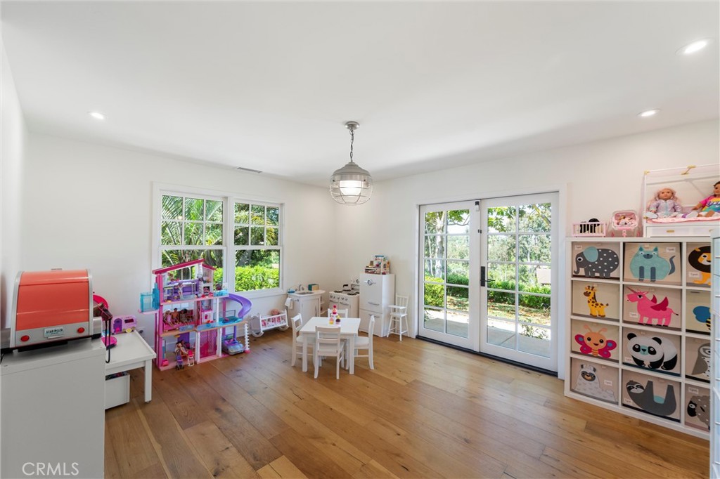 7337 La Soldadera Rancho Santa Fe, CA 92067 - Photo 15 of 60 a living room with furniture and a wooden floor