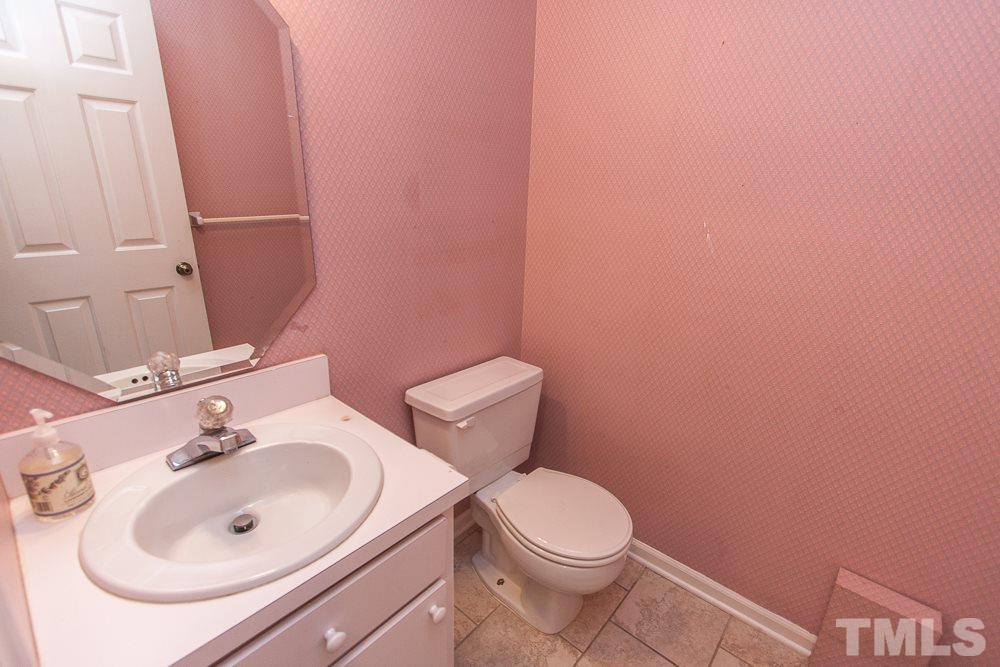 1535 Edgeside Court Raleigh, NC 27609 - Photo 13 of 20 a bathroom with a sink and a toilet