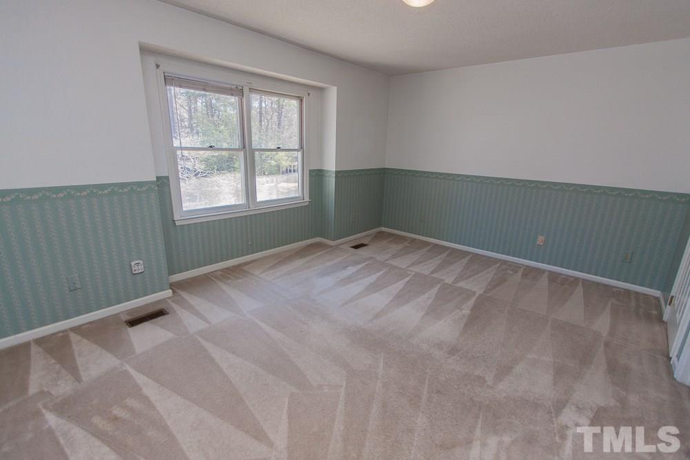 1535 Edgeside Court Raleigh, NC 27609 - Photo 14 of 20 a view of an empty room with a window