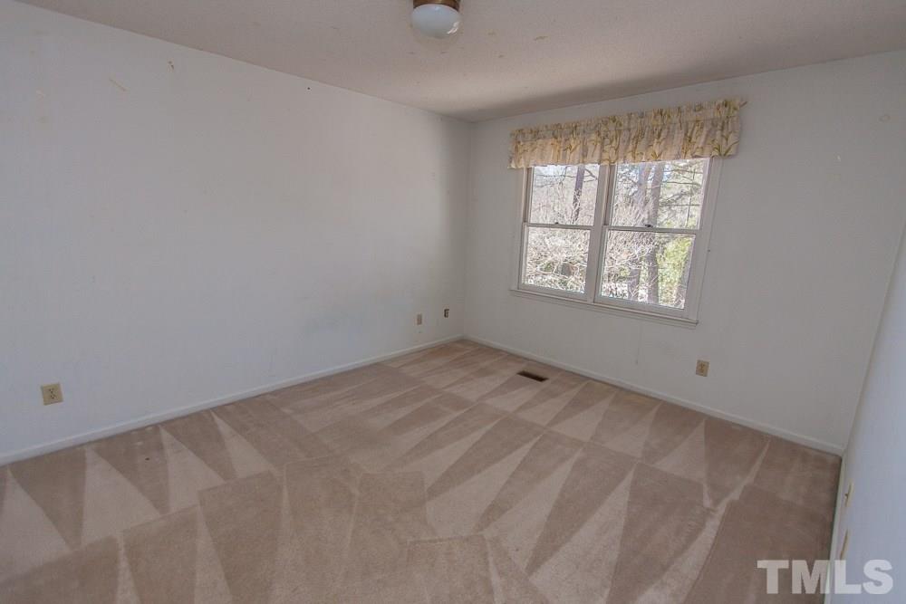 1535 Edgeside Court Raleigh, NC 27609 - Photo 17 of 20 an empty room with a window