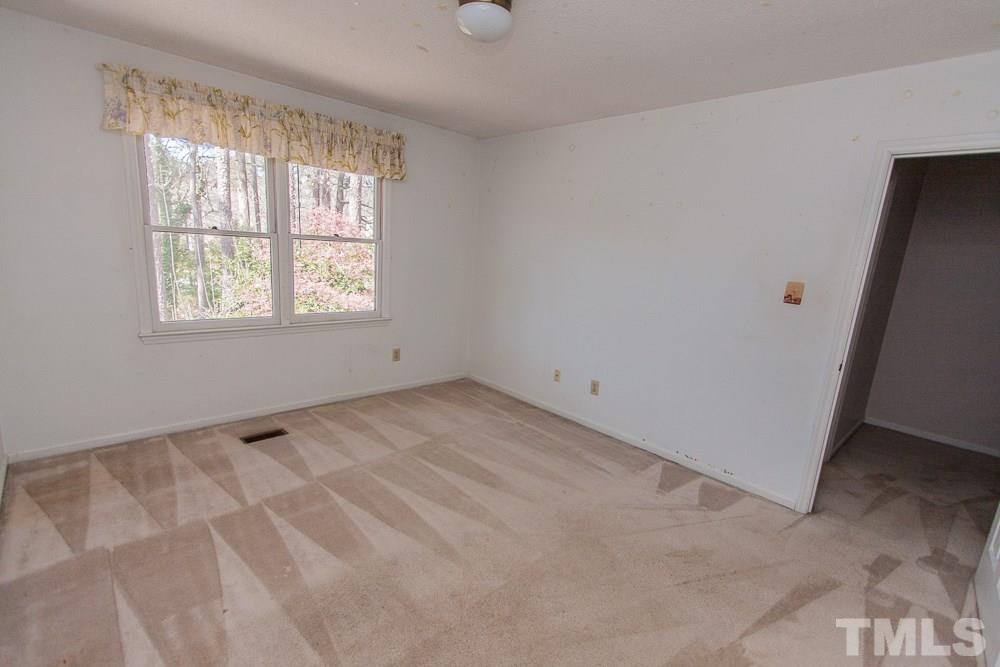 1535 Edgeside Court Raleigh, NC 27609 - Photo 18 of 20 an empty room with windows