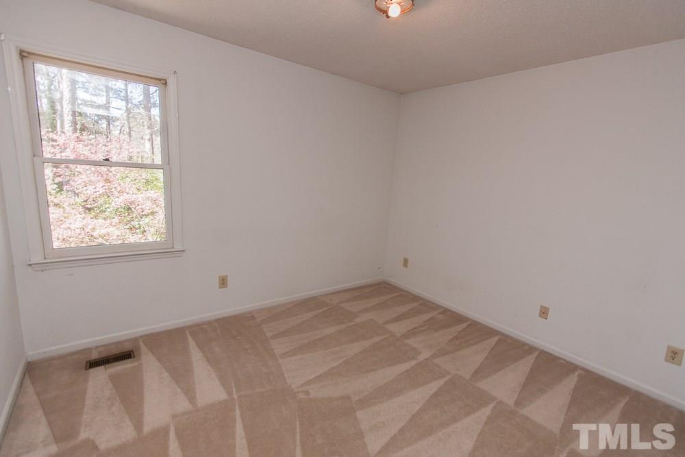 1535 Edgeside Court Raleigh, NC 27609 - Photo 19 of 20 an empty room with a window