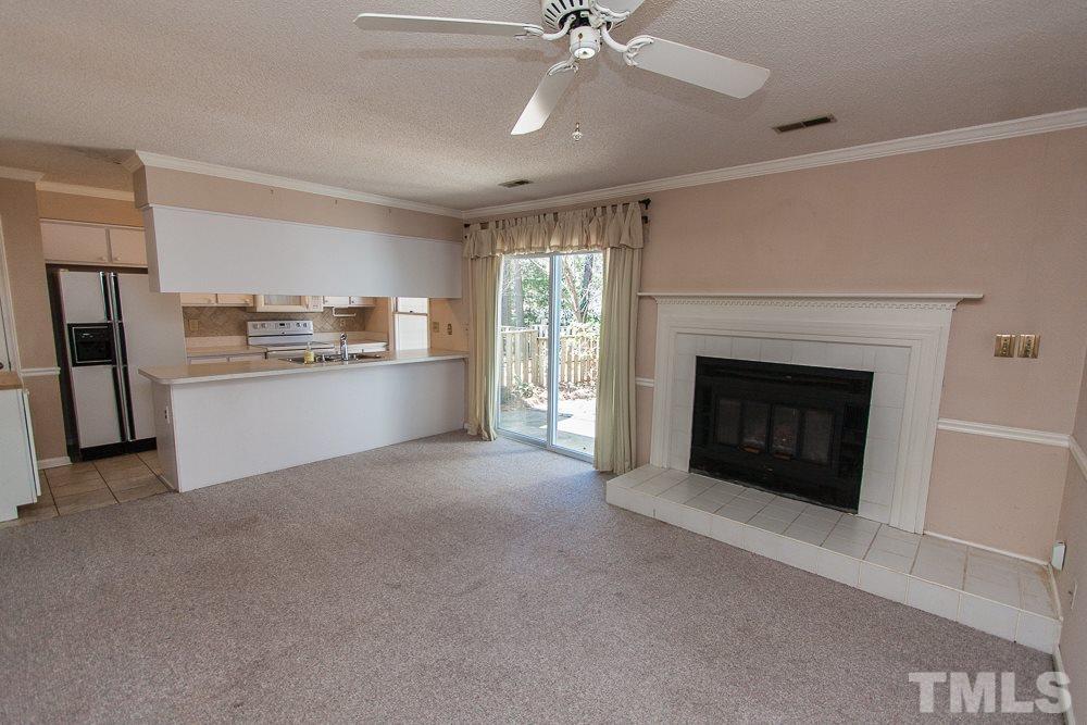 1535 Edgeside Court Raleigh, NC 27609 - Photo 7 of 20 a view of a kitchen with a stove cabinets and a fireplace