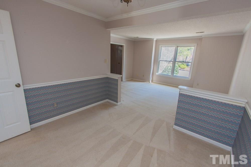1535 Edgeside Court Raleigh, NC 27609 - Photo 10 of 20 an empty room with windows